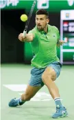  ?? — AFP photo ?? Djokovic plays a backhand against Nardi in their third round match during the BNP Paribas Open at Indian Wells Tennis Garden in Indian Wells, California.