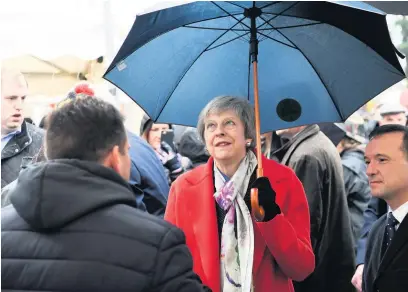  ?? Picture: WPA Pool ?? Britain’s Prime Minister Theresa May meets with agricultur­al producers at the Winter Fair.