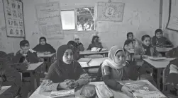  ?? ODED BALILTY/AP ?? Bedouin students attend school in the West Bank. Israel’s new government has pledged to ramp up constructi­on of settler homes there.