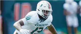  ?? LYNNE SLADKY/AP ?? UM defensive end Deandre Johnson does drills Aug. 31 in Coral Gables.