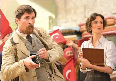  ?? Associated Press photos ?? This image released by Open Road Films shows Charlotte Le Bon, right, and Christian Bale in a scene from “The Promise.”