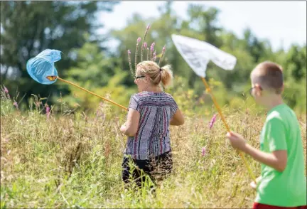  ?? CARRIE GARLAND FOR THE NEWS-HERALD ?? Monarch butterflie­s were the theme of this year’s Best of the Bluffs Aug. 18 in Perry Township.