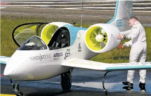  ?? BOB EDME/THE ASSOCIATED PRESS ?? French airline pilot Didier Estyene prepares to fly an E-Fan, an electrical­ly powered general aviation aircraft, in 2014 in southweste­rn France. Companies have dived into developing hybrid-electric aircraft projects.