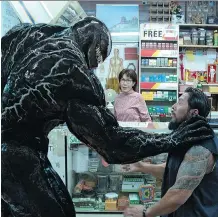  ?? COLUMBIA PICTURES ?? Tom Hardy’s Eddie Brock, a muckraking journalist turned scary monster, must fend off the alien possessing him in Venom.