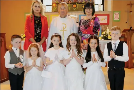  ??  ?? Kiskeam National School children who received their First Holy Communion in the Church of the Sacred Heart, pictured with their teacher Siobhán O’ Connor, acting Principal Eileen Herlihy, and Fr. Jim Kennelly PP. Photo by Sheila Fitzgerald.