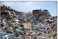  ?? AP/ARIEL SCHALIT ?? A tractor works in a landfill near the UBQ factory in Kibbutz Zeelim in Israel.