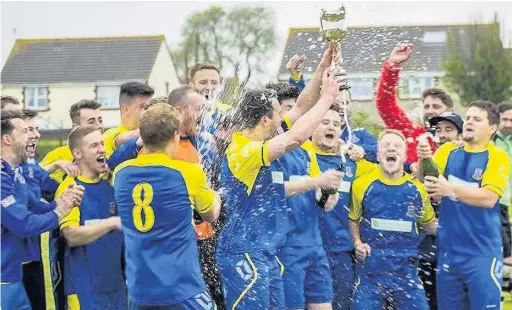  ??  ?? Llantwit Major celebrate their title success in Nathaniel Cars Welsh League Division Three