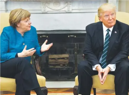  ?? Evan Vucci, The Associated Press ?? President Donald Trump meets with German Chancellor Angela Merkel in the Oval Office of the White House in Washington on Friday. The White House summit marked a high-stakes first meeting for the leaders who have clashed on a range of issues.