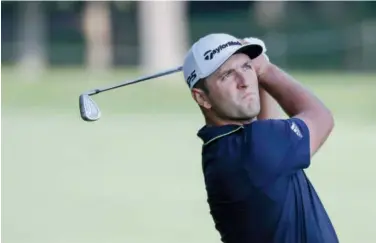  ?? Associated Press ?? ↑
Jon Rahm hits on the 13th hole during the opening round of the Workday Charity Open on Thursday.