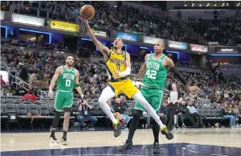  ?? (AP photo/AJ Mast) ?? Indiana Pacers guard Tyrese Haliburton (0) shoots in front of Boston Celtics center Al Horford (42) Thursday during the second half of an NBA basketball game in Indianapol­is. The Celtics won 142-138 in overtime.