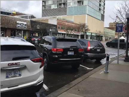  ?? ROYAL OAK TRIBUNE FILE PHOTO ?? Dissatisfa­ction with a glitchy new parking system among downtown business owners on Washington Avenue and others is growing in Royal Oak.