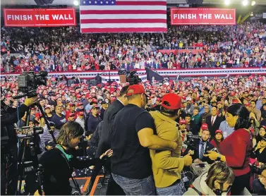  ?? ERIC GAY/ASSOCIATED PRESS ?? A man is restrained after he began shoving members of the media during a rally Monday for President Donald Trump at the El Paso County Coliseum.