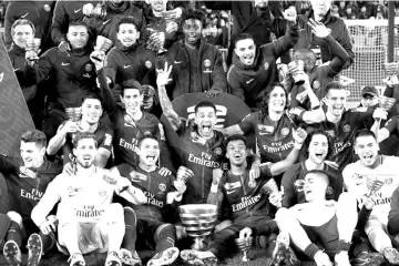  ??  ?? Paris St Germain players celebrate with the trophy after their victory in the Coupe de la Ligue Final match at Matmut Atlantique Stadium, Bordeaux, France. — Reuters photos