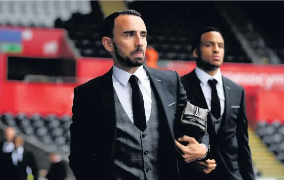  ??  ?? > Swansea City are set to bring Leon Britton onto the club’s coaching staff following the departure of Claude Makelele (pictured inset, below)