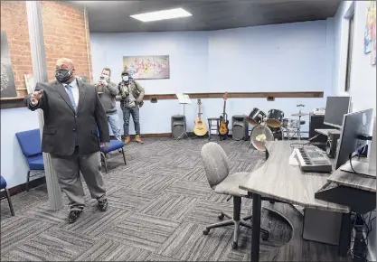  ?? Photos by Lori Van Buren / Times Union ?? Connect Center Executive Director Ben Williams gives a tour of the new Cohoes center’s Music Studio & Connect Lab Wednesday. The site is a space for youth to access technology for school work and creative work.