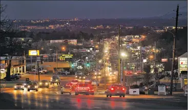  ?? NWA Democrat-Gazette/ANDY SHUPE ?? Traffic makes its way Thursday past Evelyn Hills Shopping Center along College Avenue in Fayettevil­le. Fayettevil­le plans to hire a consultant to assist with a redevelopm­ent of the College Avenue corridor from North Street north to the city limit.