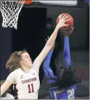  ?? ISAAC BREKKEN — THE ASSOCIATED PRESS ?? Stanford’s Ashten Prechtel, left, blocks a shot attempt by UCLA forward Michaela Onyenwere, who neverthele­ss scored a game-high 30 points to no avail Sunday.