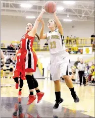  ?? NWA DEMOCRAT-GAZETTE MICHAEL WOODS ?? Prairie Grove guard Mattie Hartin (23) tries to drive past Farmington defender Camryn Journagan (11) during Hartin’s senior season. Mattie and her twin sister, Taylor Hartin, have been selected each as female Athlete of the Year at Prairie Grove for...