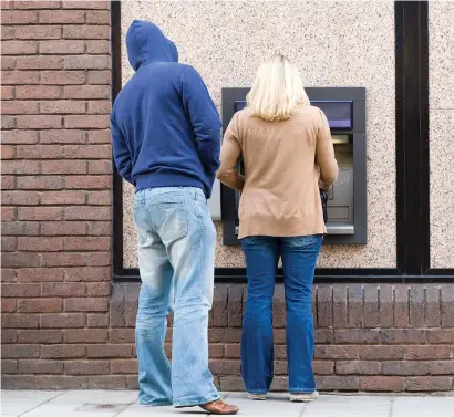  ??  ?? Not being aware of one’s surroundin­gs while withdrawin­g money from ATMs can result in robberies, police have warned.