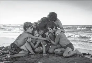  ?? THE CANADIAN PRESS/HO, CARLOS SOMONTE, NETFLIX ?? Marco Graf as Pepe, left, Daniela Demesa as Sofi, Yalitza Aparicio as Cleo, Marina De Tavira as Sofia, Diego Cortina Autrey as Tono, Carlos Peralta Jacobson as Paco are shown in a scene from “Roma” written and directed by Alfonso Cuaron in this handout photo. The Toronto Film Critics Associatio­n has handed “Roma” two of its top prizes