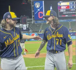  ?? PHIL LONG — THE ASSOCIATED PRESS ?? Milwaukee Brewers starter Corbin Burnes, left, and reliever Josh Hader celebrate after pitching a combined no-hitter against the Cleveland Indians on Saturday night.