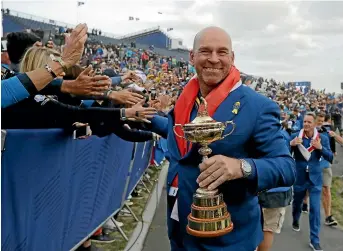  ?? AP ?? Europe captain Thomas Bjorn mingles with ecstatic fans after his team regained the Ryder Cup off the United States outside Paris earlier this week.