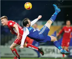  ??  ?? OVER IT COMES: Brett Pitman scores his late winner