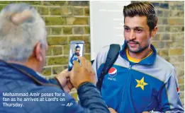  ?? — AP ?? Mohammad Amir poses for a fan as he arrives at Lord’s on Thursday.