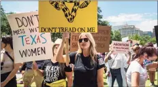  ?? Sergio Flores / TNS ?? Thousands of protesters gathered outside the Texas Capitol in Austin in May to show their concern about restrictiv­e abortion legislatio­n that was headed to Gov. Greg Abbott’s office. The law, which bans almost all abortions in the state, went into effect Sept. 1.