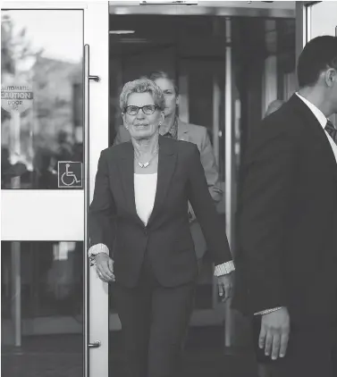  ?? SEAN KILPATRICK / THE CANADIAN PRESS ?? Ontario Premier Kathleen Wynne leaves the courthouse in Sudbury, Ont., after appearing as a witness on Wednesday in the Election Act bribery trial of two Ontario Liberal officials.