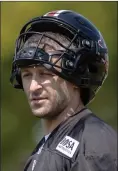  ?? The Canadian Press ?? B.C. Lions quarterbac­k Mike Reilly looks on during practice at the CFL team’s facility in Surrey on Tuesday.