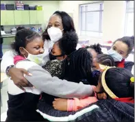  ?? ?? Averett hugs students at Height Elementary after the first meeting of Gigi’s PEARLS.