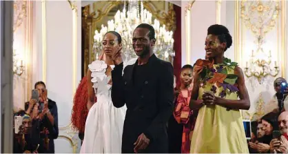  ??  ?? File photos shows Cameroonia­n fashion designer Imane Ayissi acknowledg­es the audience at the end of the Women’s Spring-Summer 2020 Haute Couture collection fashion show in Paris. — AFP photos