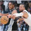  ?? ERIC GAY/AP ?? Spurs guard Tre Jones, left, and Knicks guard Jalen Brunson reach for a pass during overtime on Friday in San Antonio.