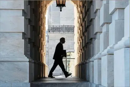  ?? Cliff Owen/Associated Press ?? Supreme Court Chief Justice John Roberts arrives Tuesday at the Capitol in Washington to preside over the impeachmen­t trial debate in the Senate.