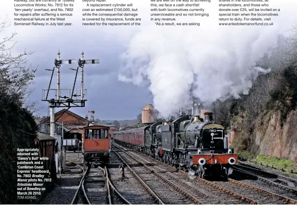  ?? TOM ADAMS ?? Appropriat­ely adorned with ‘Danny’s Bull’ white paintwork and a ‘Cambrian Coast Express’ headboard, No. 7802 Bradley Manor pilots No. 7812 Erlestoke Manor out of Bewdley on March 26 2010.