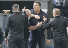  ?? ?? Baggies boss Valerien Ismael (facing) arguing with Posh staff in August.