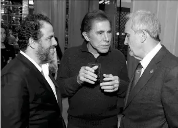  ??  ?? Brett Ratner, at left with Steve Wynn and Larry Ruvo, hosts a tasting reception for his whiskey, Hilhaven Lodge, at Sinatra at Wynn’s Encore on Tuesday, Feb. 7, 2017, in Las Vegas. |