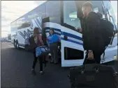  ?? BILL UHRICH — MEDIANEWS GROUP ?? Passengers prepare to board a Klein Transporta­tion bus to New York City from the Fairground­s Square Mall in Muhlenberg Township.