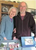  ?? PHOTO: SALLY CLIFFORD ?? Piecing together the past: Diana and Paul Monahan with the jigsaw gift Paul had created for Diana of their narrowboat Madeley.