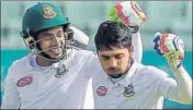  ?? AFP ?? ■ Bangladesh’s Mominul Haque (right) celebrates his century with Mushfiqur Rahim on the first day of the second Test on Sunday.