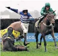 ??  ?? Spectacula­r fall: Jockey Harry Cobden is sent flying as Cyrname comes a cropper