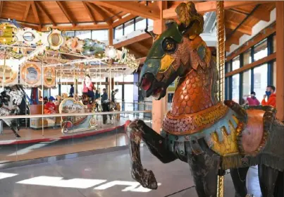  ?? Nancy J. Parisi ?? A partially restored carousel horse stands near the Buffalo Heritage Carousel at Canalside in Buffalo, N.Y.