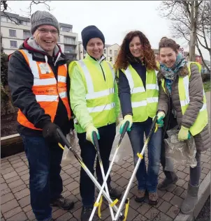  ??  ?? ( L- R), Des Faul, Austin O’Callaghan, Cliodhna Maguire and Mairead Giblin do some volunteeri­ng for the Tidy Towns at a Good Friday Clean- Up in recent years.