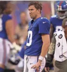  ?? DANNY WILD/USA TODAY SPORTS ?? Giants coach Ben McAdoo has decided to bench quarterbac­k Eli Manning.