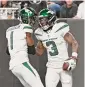  ?? David Becker/Associated Press ?? Jets safety Jordan Whitehead (3) is congratula­ted by Sauce Gardner after intercepti­ng a pass against the Raiders on Sunday.