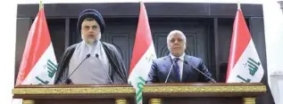  ?? - Iraqi Prime Minister Media Office handout via Reuters ?? BRIEFING: Iraqi cleric Moqtada Al Sadr, left, speaks at a news conference with Iraqi Prime Minister Haider Al Abadi in Baghdad, Iraq on May 20, 2018.