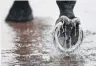  ?? PHOTO: GETTY IMAGES ?? Stormy . . . Water builds up in the mounting yard yesterday before race 2 during Melbourne Cup Day at Flemington Racecourse, in Melbourne, Australia.