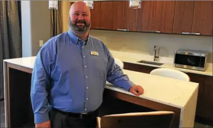  ?? GARY PULEO — DIGITAL FIRST MEDIA ?? Valley Forge Casino Resort CEO Eric Pearson in the kitchen area of one of the newly remodeled suites in the casino tower.