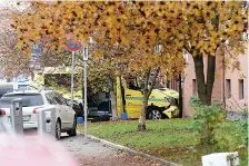  ?? Stian Lysberg Solum/NTB scanpix via AP ?? ■ A damaged ambulance is seen crashed into a building after an incident Tuesday in the center of Oslo. Norwegian police opened fire on an armed man who stole an ambulance in Oslo and reportedly ran down several people.